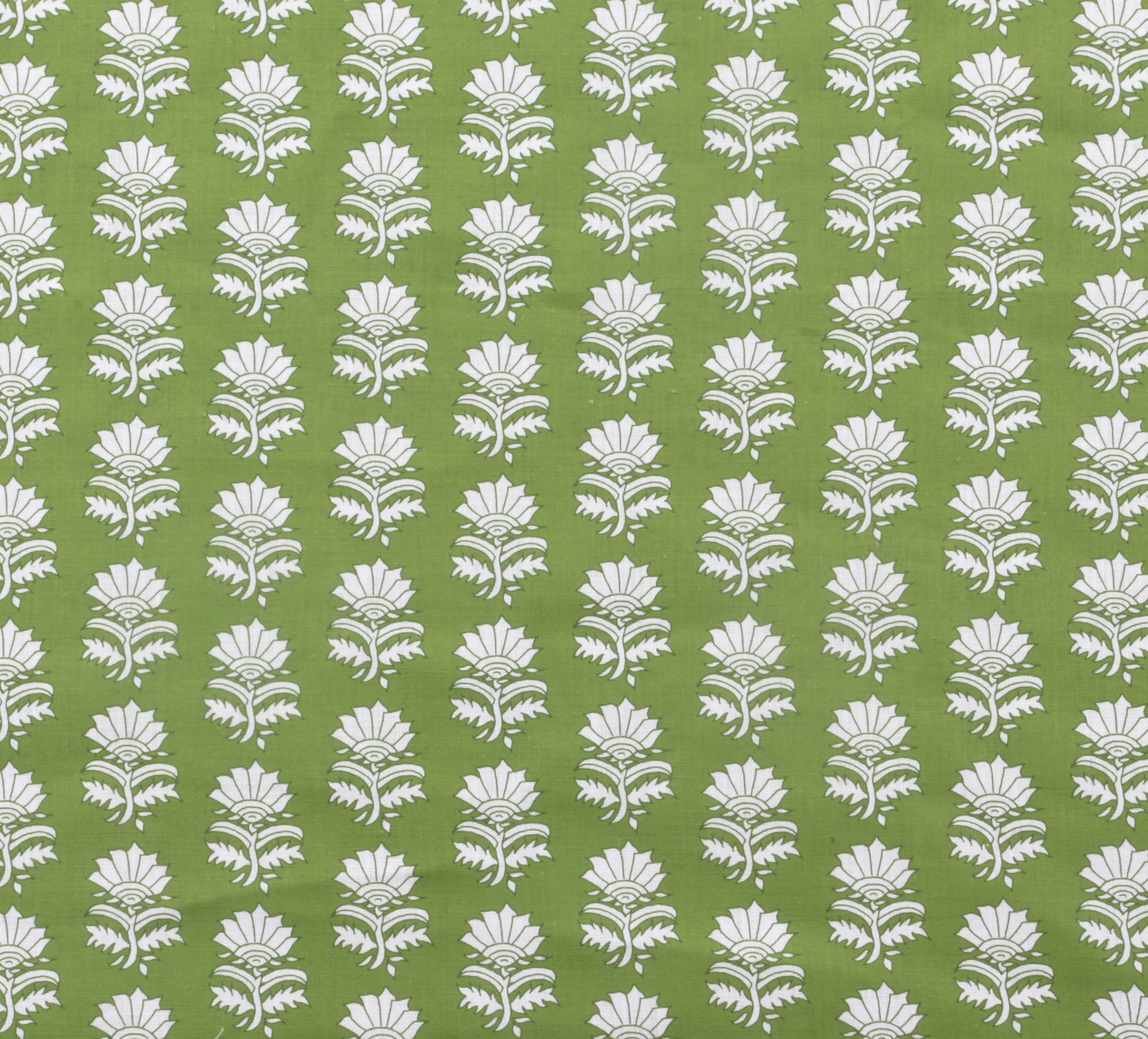 Detail of fabric in a repeating thistle print in white and green on a green field.