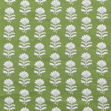 Detail of fabric in a repeating thistle print in white and green on a green field.