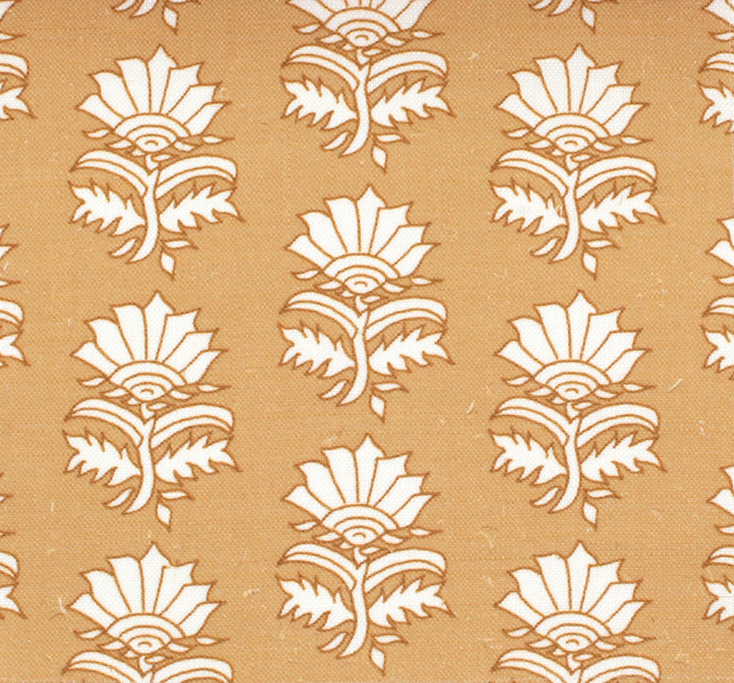 Detail of fabric in a repeating thistle print in white and rust on an orange field.