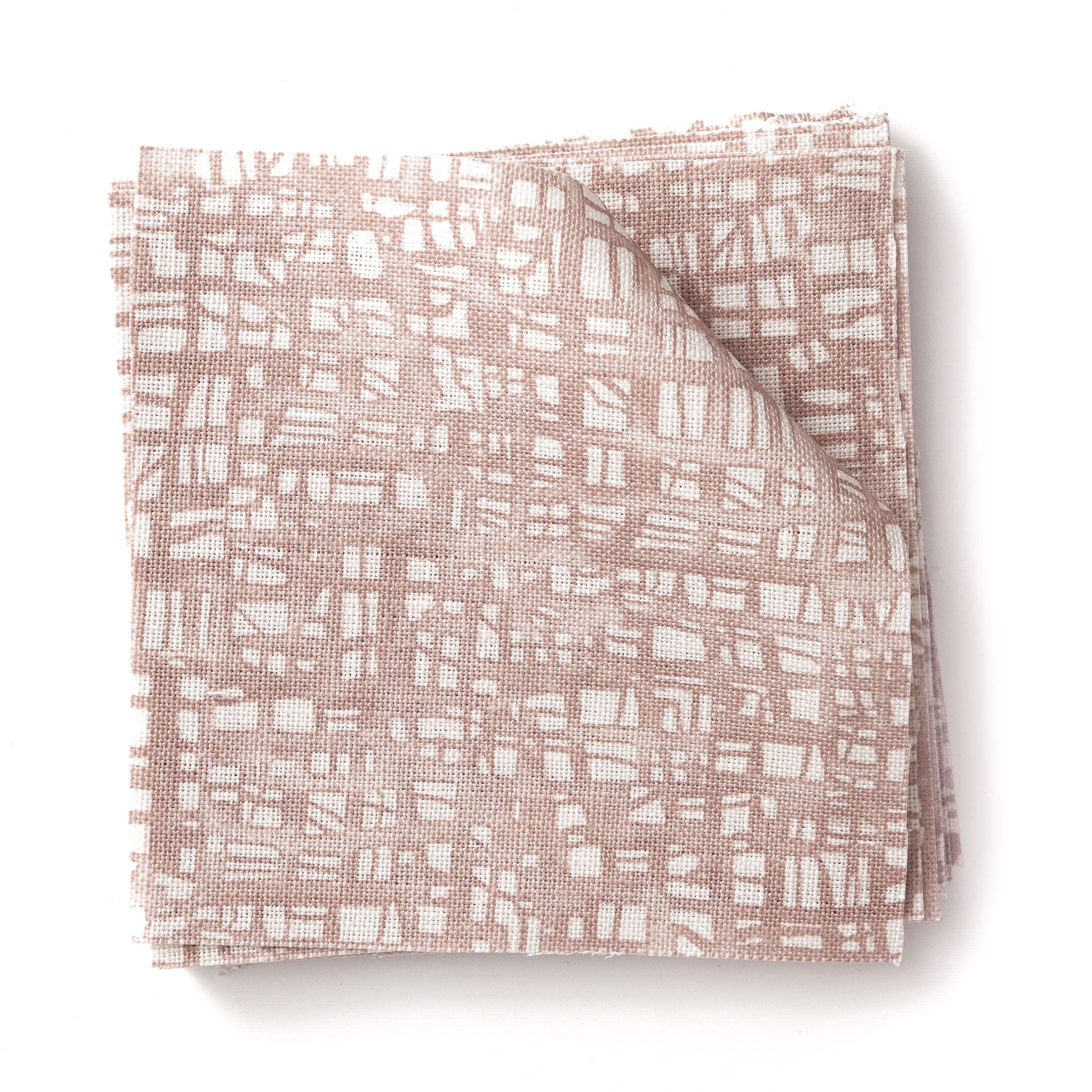 Stacked swatches of fabric in a textural wicker pattern in blush pink on a white field. 