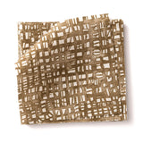 Stacked swatches of fabric in a textural wicker pattern in warm brown on a white field. 