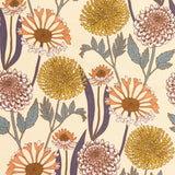 Detail of fabric in a large-scale floral print in yellow, orange and green on a yellow field.