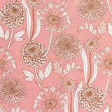 Detail of fabric in a large-scale floral print in orange and white on a light pink field.