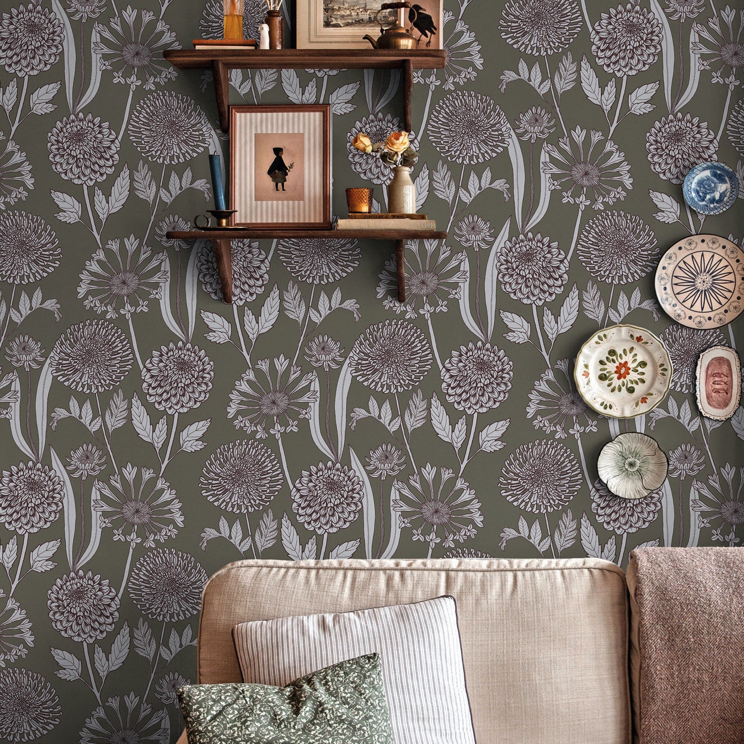 Living room with floral wallpaper, a sofa, and decorative items.