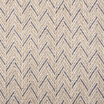 Broadloom carpet in a herringbone pattern in cream with blue accents.
