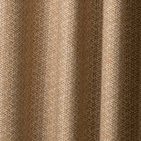 Draped printed fabric in a detailed geometric pattern in cream on a camel field.