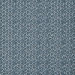 Detail of a linen fabric in a detailed geometric pattern in white on an indigo field.