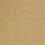 Detail of a linen fabric in a detailed geometric pattern in white on a goldenrod field.