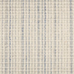 Broadloom carpet in textured stripe in striated light blue and cream.
