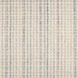 Broadloom carpet in textured stripe in striated light blue and cream.