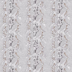 Detail of fabric in a striped wisteria print in shades of white and brown on a light gray field.