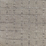 Broadloom carpet with raised gridded plaid in shades of grey and cream on a pale grey field.