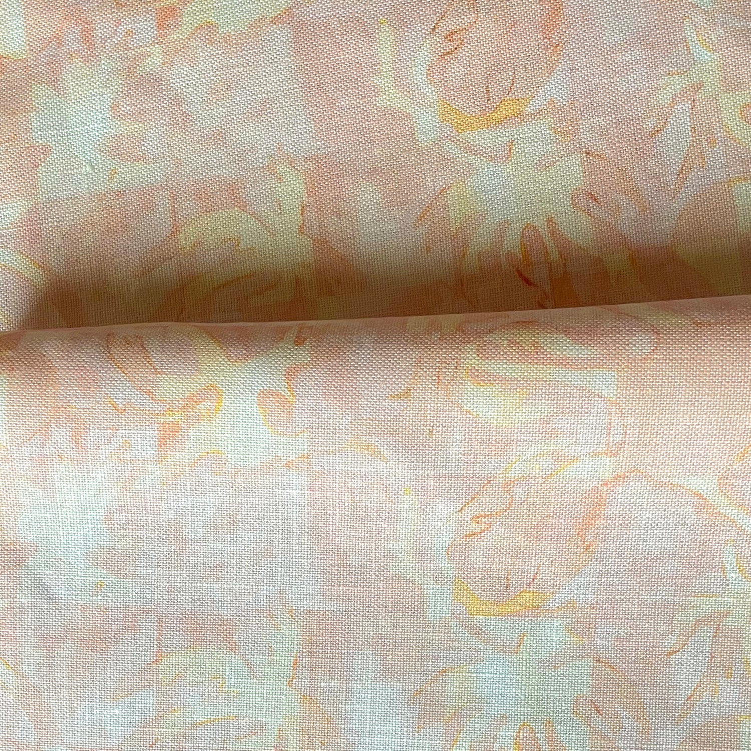Drape fabric in painterly tropical checkerboard design in pinky orange and yellow. 