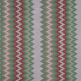 Handwoven silk fabric with zigzag design  in red, green, and white.