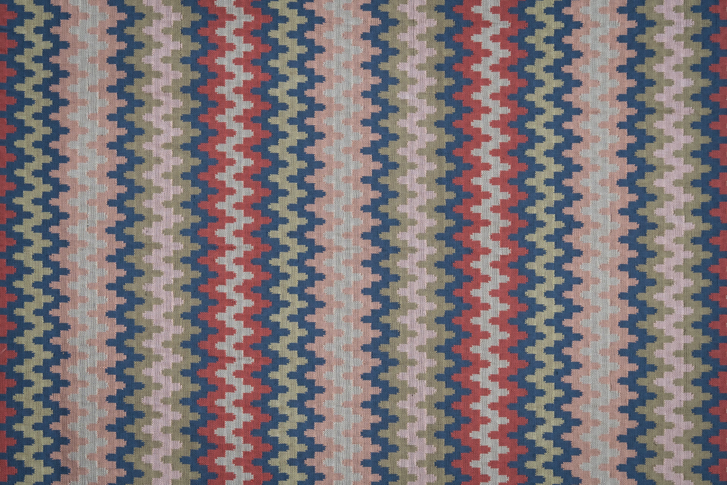 Handwoven silk fabric with zigzag design in red, blue, and beige.