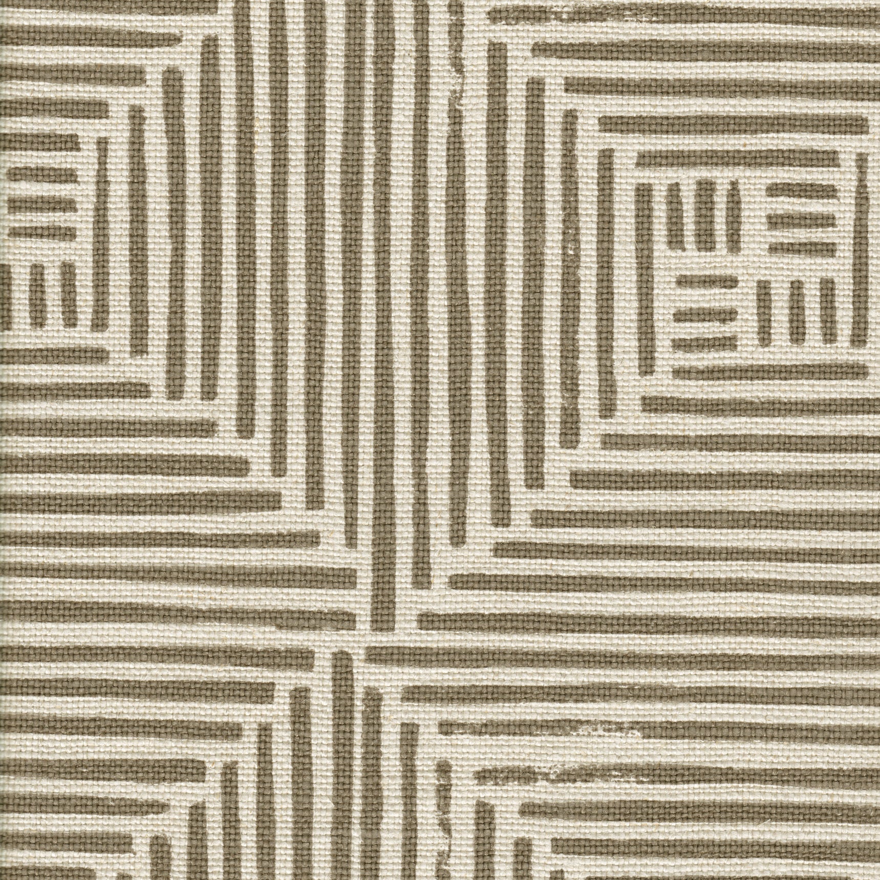 Detail of fabric in a dashed grid print in brown on a cream field.