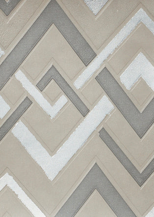 Detail of wallpaper in an interlocking zig zag print in shades of white, gray and tan.