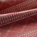 Close-up of patterned red abric with geometric design