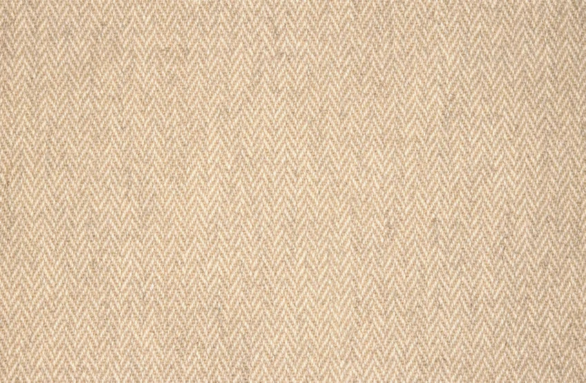 Broadloom carpet with a subtle herringbone pattern int tan and ivory