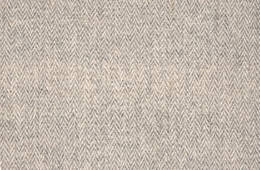 Broadloom carpet with a subtle herringbone pattern in heather grey