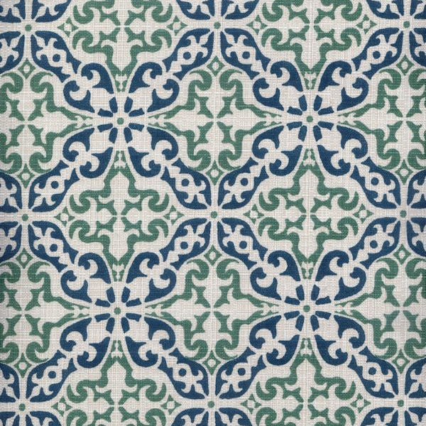 Detail of fabric in a damask print in green and navy on a cream field.