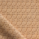 Fabric with small scale watercolor floral in warm beige. 