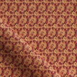 Fabric with small scale watercolor floral in red and orange.