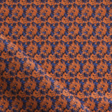 Fabric with small scale watercolor floral in blue and orange.