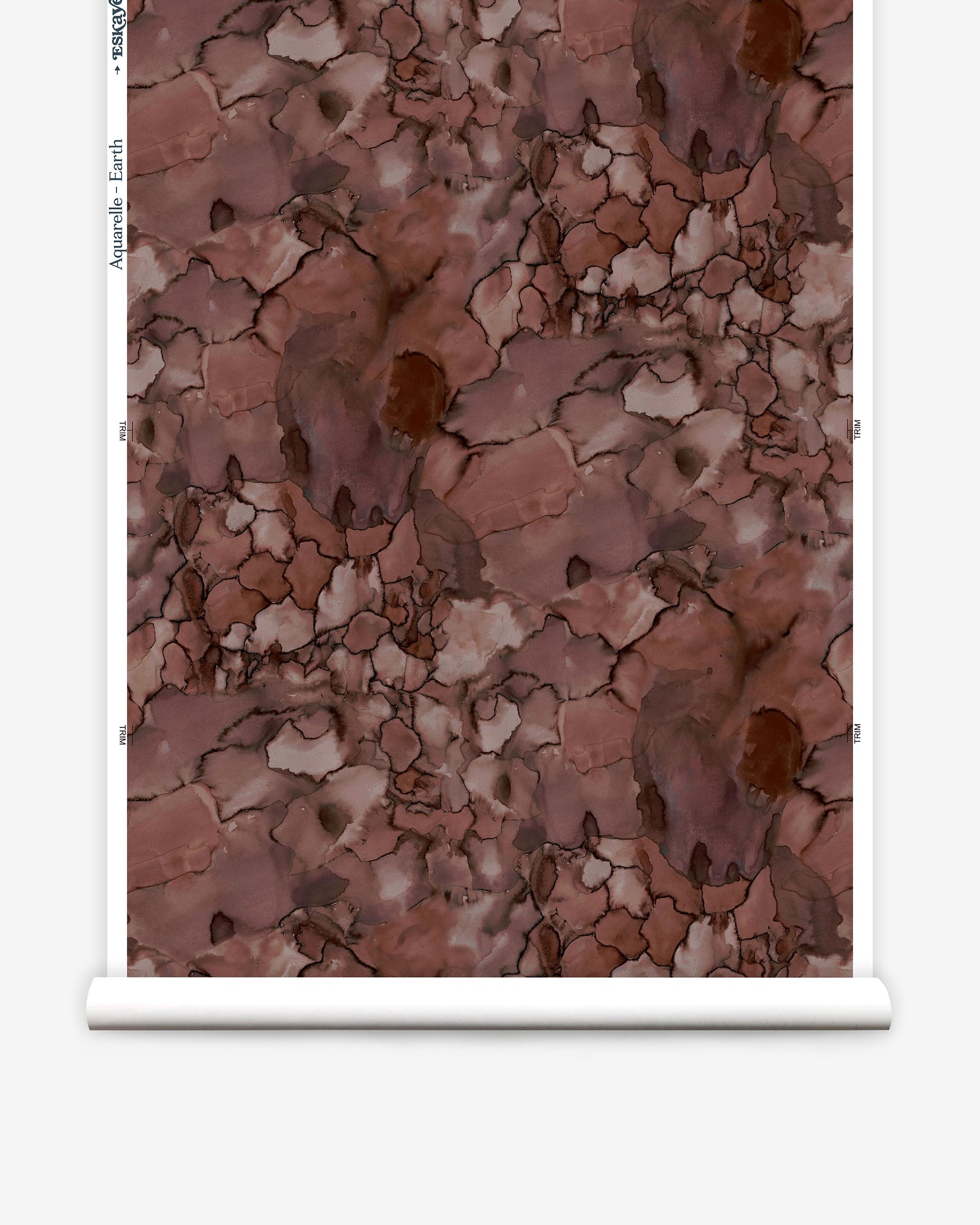 Partially unrolled wallpaper yardage in a watercolor textural print in shades of red, gray and black.