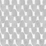 Detail of fabric in an abstract scalloped print in gray on a white field.