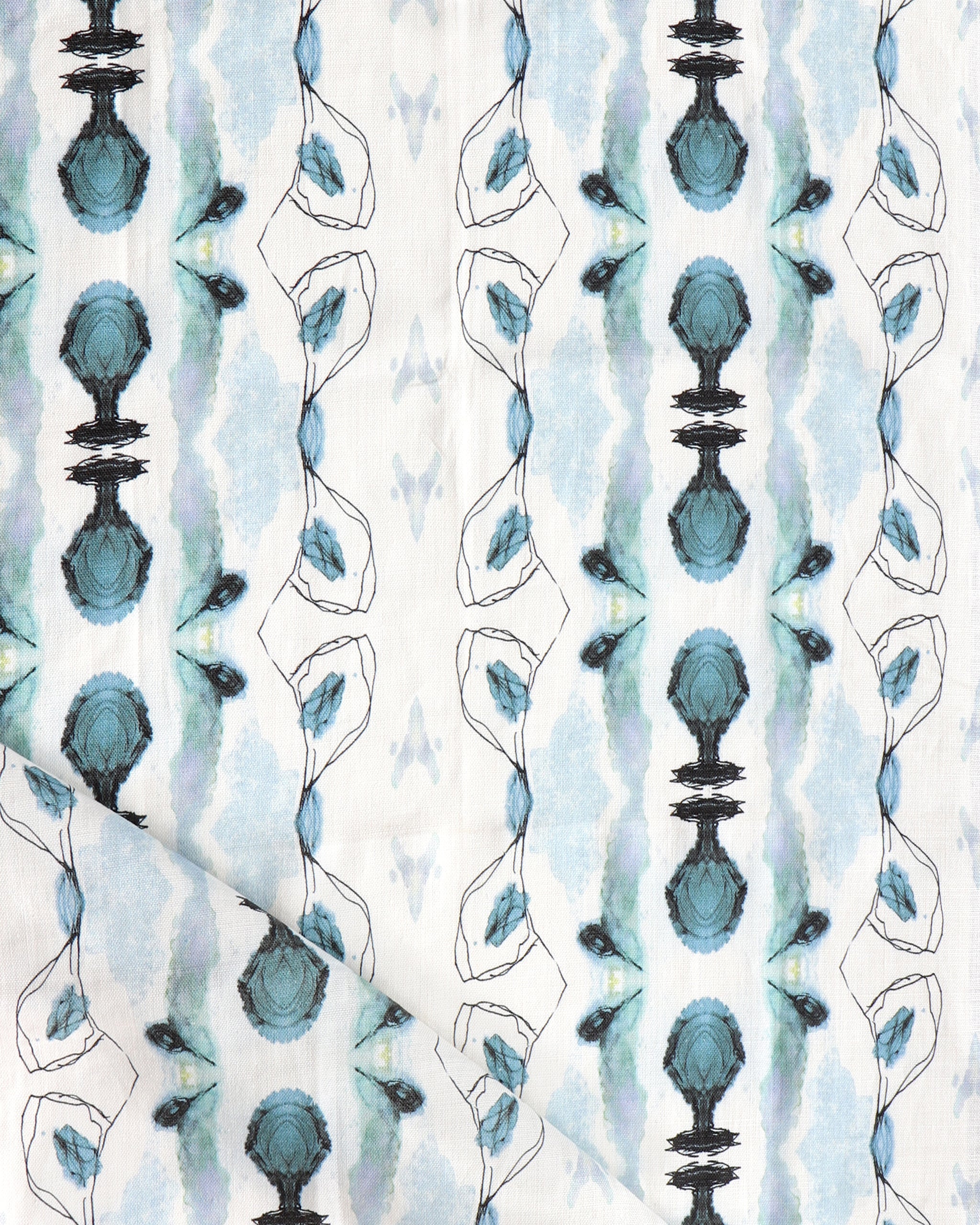 Detail of draped fabric yardage in a watercolor ikat stripe print in shades of blue and gray on a white field.