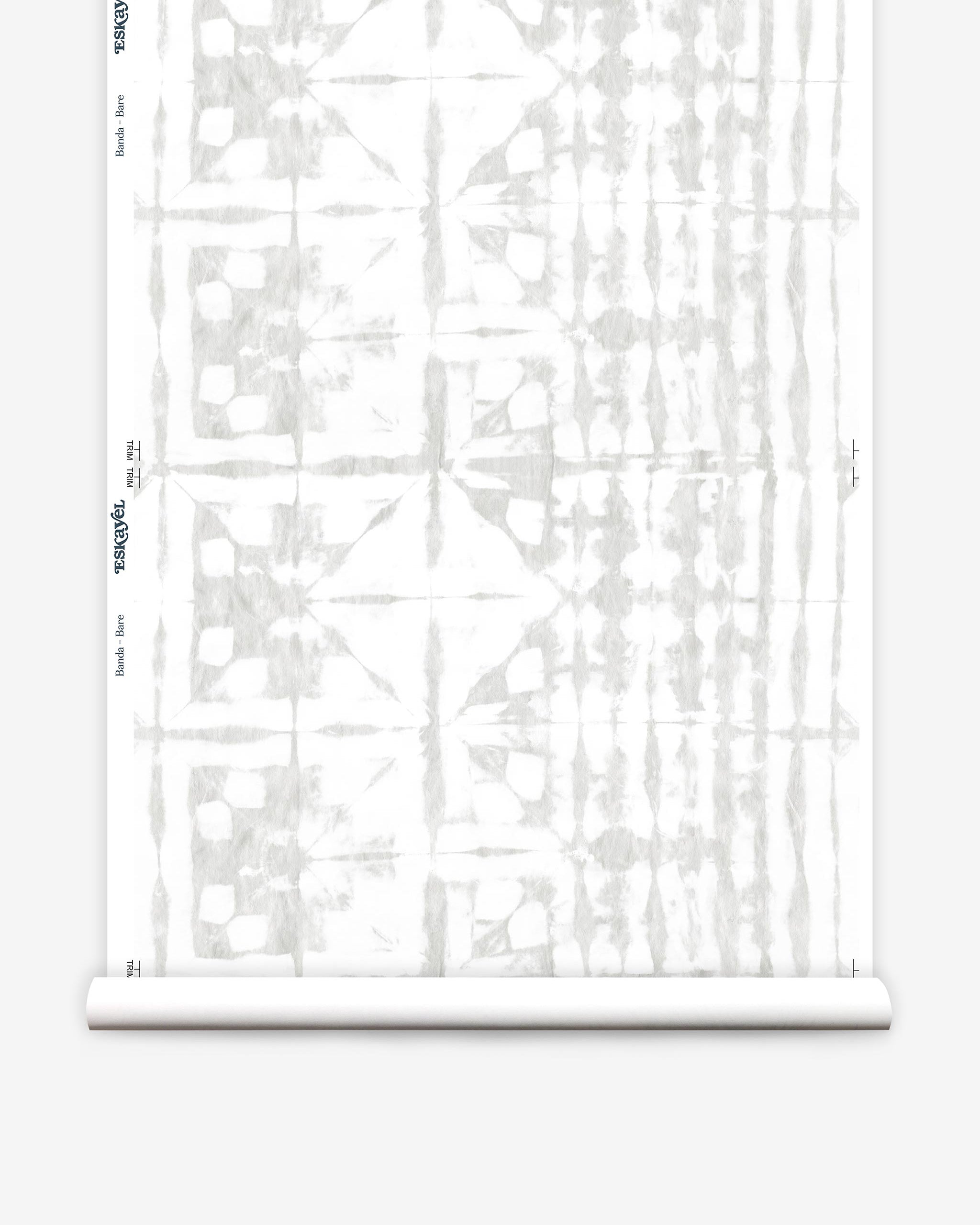 Partially unrolled wallpaper yardage in a watercolor dyed grid print in mottled white and gray.