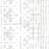 Detail of wallpaper in a watercolor dyed grid print in mottled white and gray.