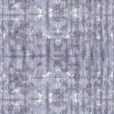 Detail of wallpaper in a watercolor dyed grid print in mottled shades of purple