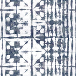 Detail of wallpaper in a watercolor dyed grid print in mottled white and navy.