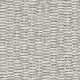 Detail of wallpaper in a textural checked print in mottled gray on a white field.