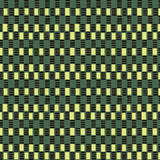 Detail of wallpaper in a geometric check print in shades of green, yellow and black.