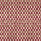 Detail of fabric in a geometric check print in shades of red, cream and tan.