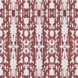 Detail of wallpaper in a painterly ikat print in rust and white.
