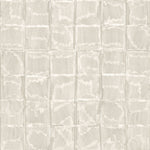 Detail of wallpaper in a textural block print in mottled tan.
