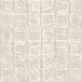 Detail of wallpaper in a textural block print in mottled tan.