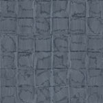 Detail of wallpaper in a textural block print in mottled blue-black.