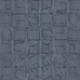 Detail of wallpaper in a textural block print in mottled blue-black.