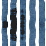 Wallpaper close up with bold watercolor stripes in inky blue and white. 