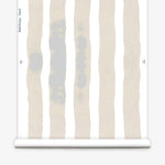 Wallpaper roll with bold watercolor stripes in beige and white on a white background.