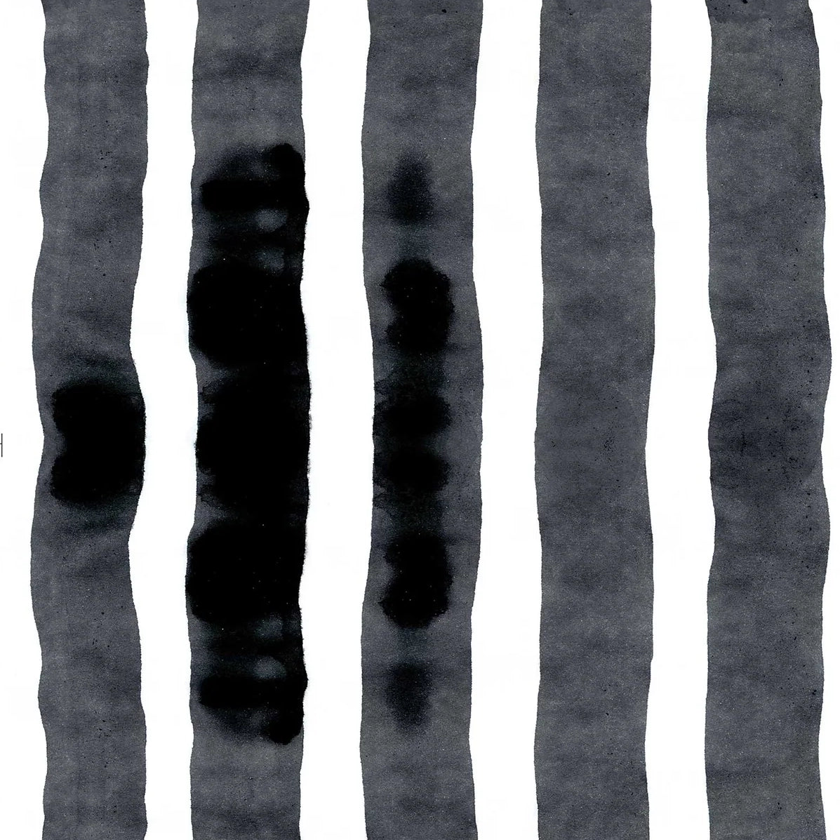 Wallpaper close up with bold watercolor stripes in black and white. 