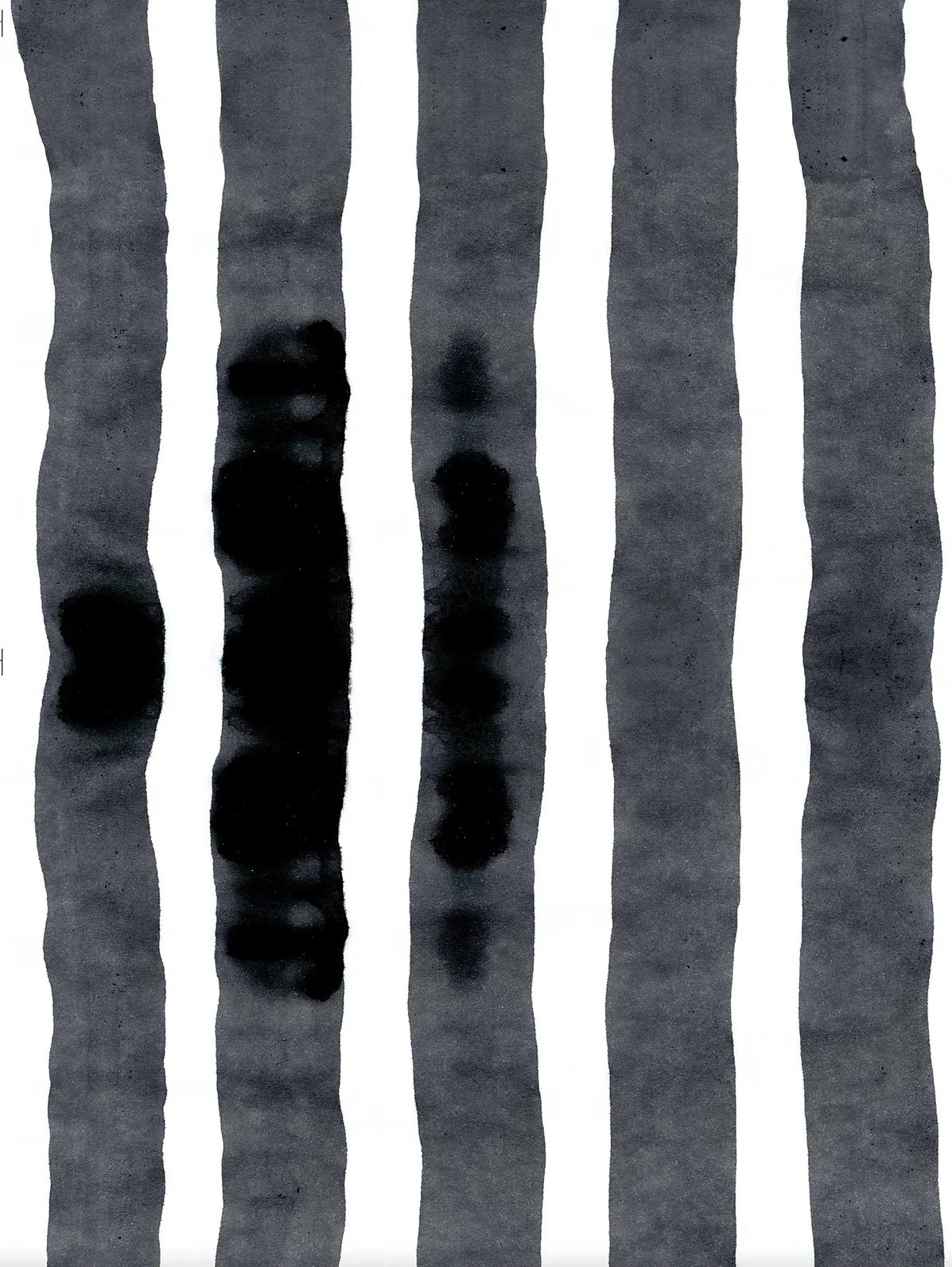 Wallpaper close up with bold watercolor stripes in black and white. 