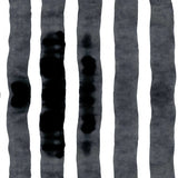 Wallpaper close up with bold watercolor stripes in black and white. 