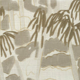 Close-up of fabric in a painterly palm tree print in shades of gray and gold on a white field.