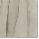 Detail of a handmade wallpaper swatch with an irregular combed stripe pattern in charcoal on a greige field.